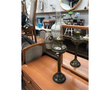 A brass oil lamp.