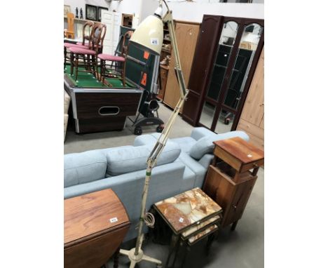 A floor standing angle poise lamp.