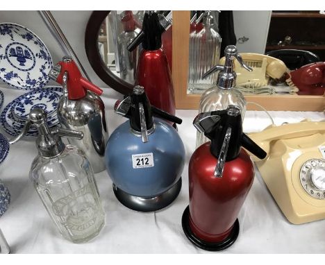 6 vintage soda syphons.