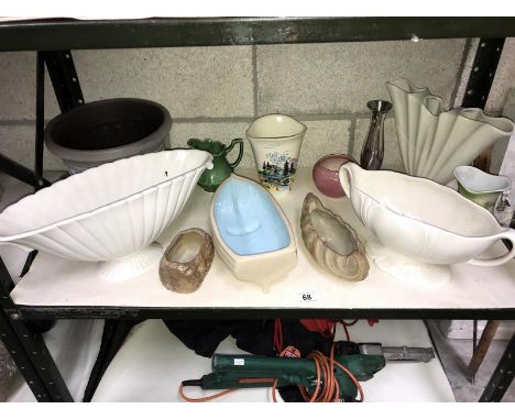 A shelf of garden and plant pots.