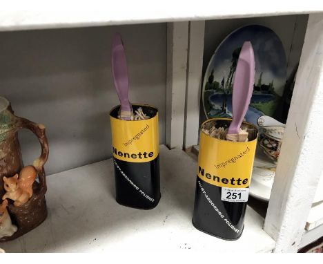 2 vintage Nenette dusters in tins.