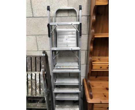 An extending aluminium ladder and an aluminium trestle ladder.
