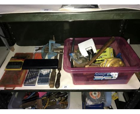 A shelf of tools including screwdrivers &amp; vice etc.