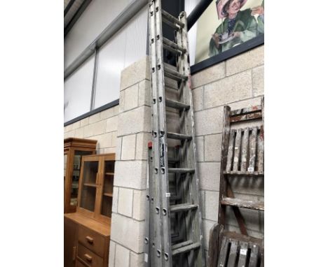 An extending aluminium ladder (3m - 5.44m) and 2 short aluminium ladders.