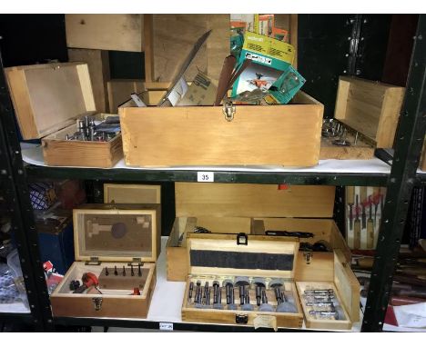 2 shelves of boxed tools including Fosner bits &amp; router bits etc.