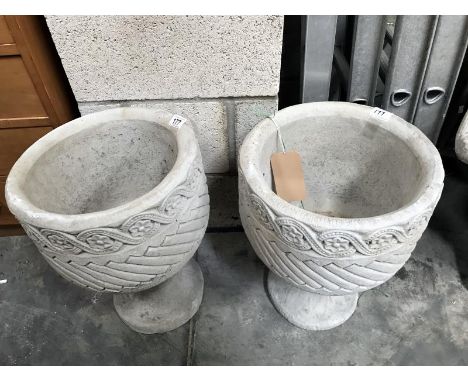 2 Mayan urn circular garden planters decorated with Aztec design.