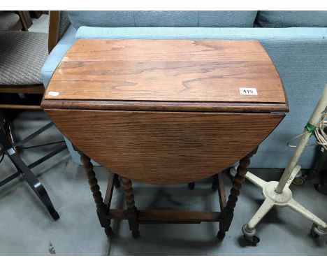 A small oak barley twist gate leg table.