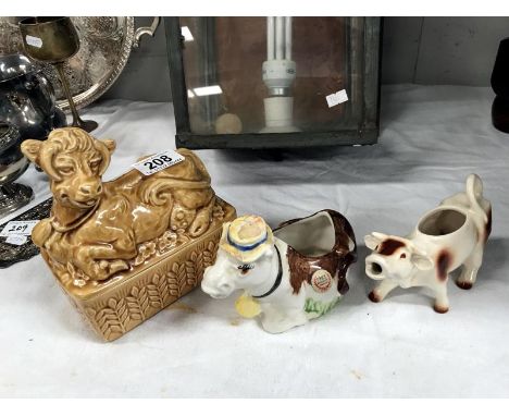 A Goebel cow creamer, a Sylvac butter dish and a cow figure with Price Kensington label.