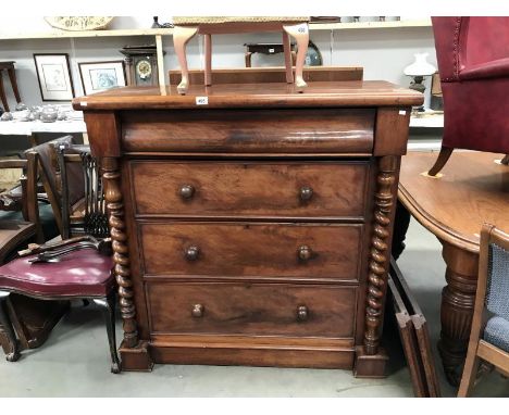 A Victorian mahogany 4 drawer Scotch chest with barley twist columns.