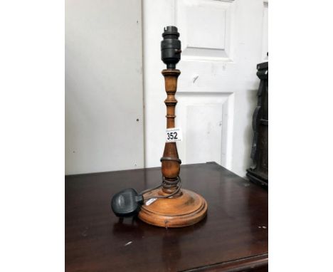 A wooden table lamp base.