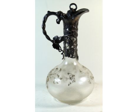 An Arts & Crafts WMF silver-plated claret jug
Of bulbous form having frosted glass body with gilt highlights, the collar havi