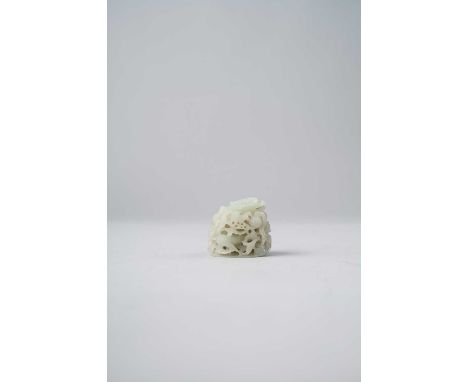 A GOOD CHINESE RETICULATED CELADON JADE FINIALMING/QING DYNASTYElaborately carved with openwork floral peony scrolls enclosin