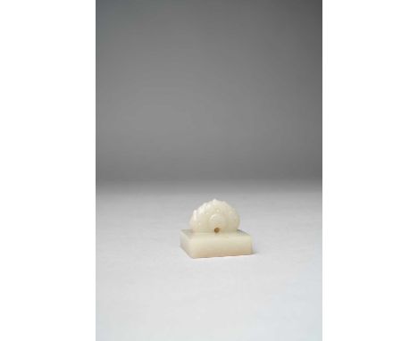 A CHINESE WHITE JADE SQUARE SEALQING DYNASTY OR LATERCarved with a flame-shaped finial, the seal face with four seal script c