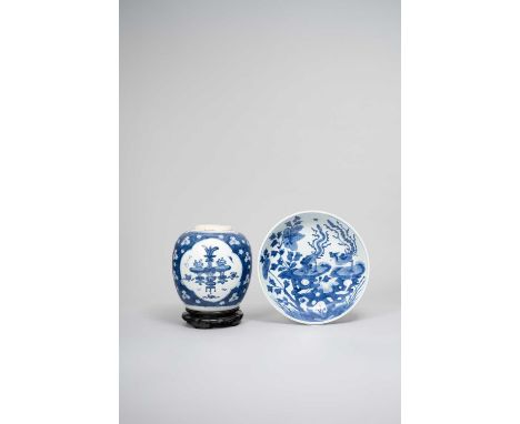 A CHINESE BLUE AND WHITE ‘PHOENIX AND PEONY’ DISH AND A ‘HUNDRED ANTIQUES’ VASEKANGXI 1662-1722The dish painted to the centre