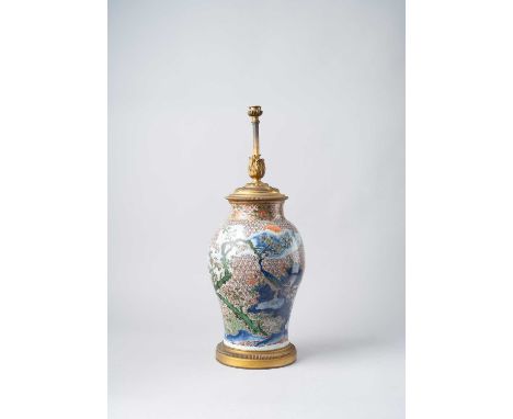 A CHINESE WUCAI 'PEACOCK' VASE17TH CENTURYPainted to the exterior with a large peacock perched on rockwork amidst large peony