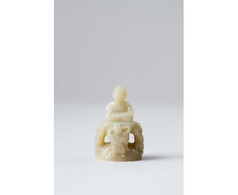 NO RESERVEA CHINESE SMALL CELADON JADE FINIAL OF SHAKYAMUNI BUDDHA MING DYNASTY OR LATER  Seated upon a double-lotus plinth, 