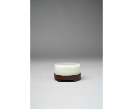 A CHINESE WHITE JADE CIRCULAR BOX AND COVERQING DYNASTY OR LATERThe plain box of shallow form, with a flat cover and base, th