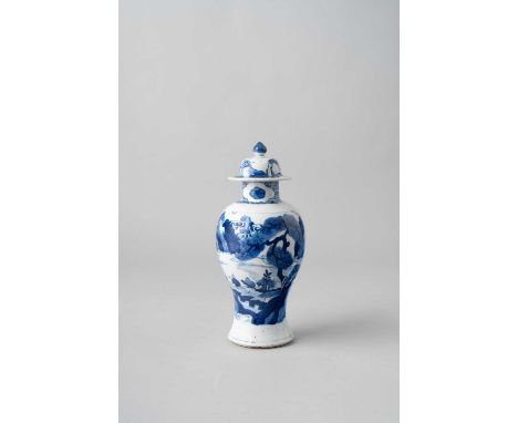 A CHINESE BLUE AND WHITE BALUSTER VASE AND COVER KANGXI 1662-1722Painted with two panels containing figures in a rocky landsc