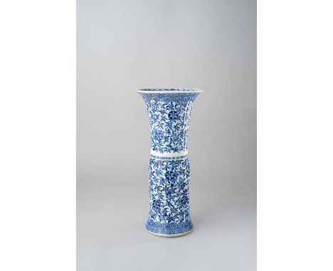 NO RESERVEA CHINESE BLUE AND WHITE MOULDED GU-SHAPED VASE KANGXI 1662-1722  The fluted sides decorated with a pattern of scro