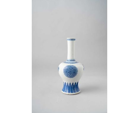 A CHINESE BLUE AND WHITE BOTTLE VASEKANGXI 1662-1722The body painted with two large stylised flowerheads divided by smaller f