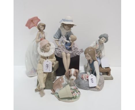 Six Lladro figures including girl and doll etc Condition Report:Available upon request