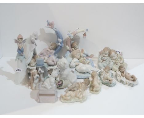 A collection of Lladro groups of sleeping babies, a bell and three animal figures Condition Report:Available upon request
