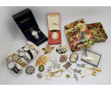 An early plastic box filled with vintage costume jewellery and watches Condition Report:Not available for this lot.