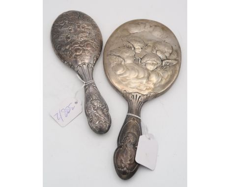 A silver hand mirror with cast decoration of Reynold's Angels, by William Comyns, London 1907, and another smaller example, C