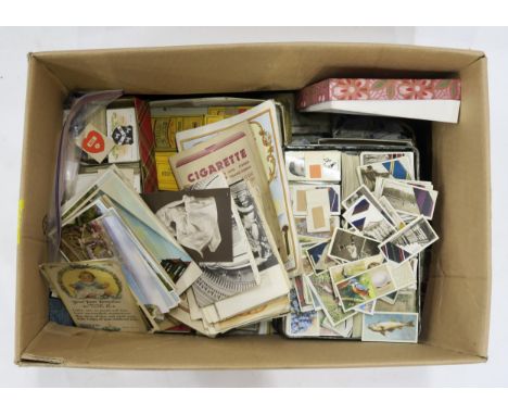 A large quantity of cigarette cards, varied subjects, to include coats of arms, footballers, wildlife, aircraft and many othe