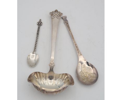 A Norwegian silver sauce ladle, with a lobed bowl and a pierced openwork terminal, a silver teaspoon, the terminal styled as 