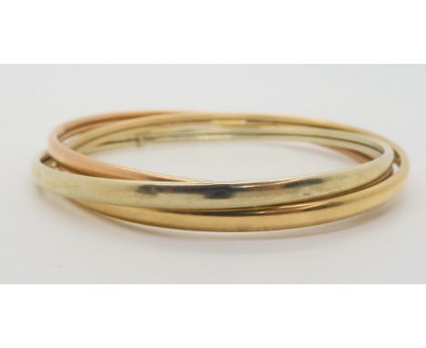 A 9ct three colour gold Russian wedding band style bangle, weight 13.7gms Condition Report:Available upon request