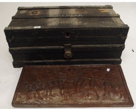 A 20th century decorative wall plaque depicting a tug of war and a wood bound travel trunk (2) Condition Report:Available upo