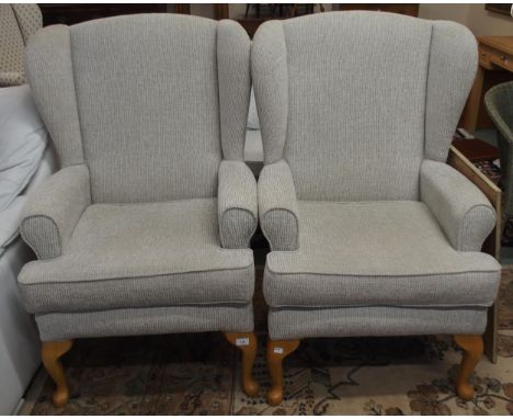 A pair of contemporary wing back armchairs with light grey upholstery on cabriole supports (2) Condition Report:Available upo