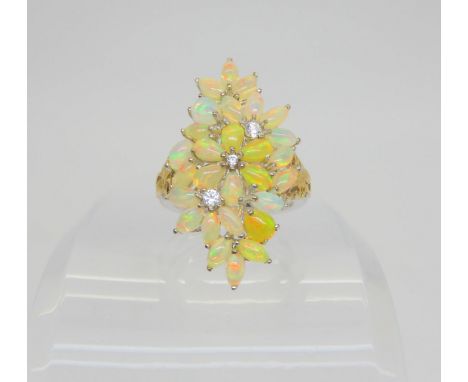 A silver opal and cz cluster statement ring, size P, weight 6.2gms Condition Report:Available upon request