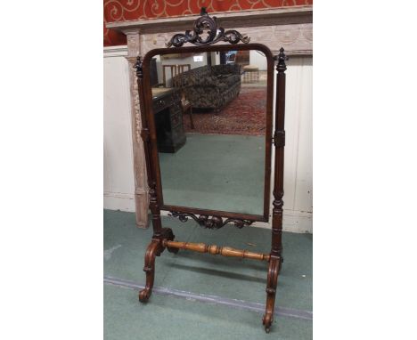 A Victorian mahogany cheval mirror with turned uprights on stretchered scrolled base, 143cm high x 70cm wide x 54cm deep Cond