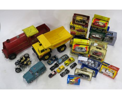 A varied selection of toy and scale model vehicles, to include a large Tri-ang Express motorcar, a Tonka Euclid truck, assort