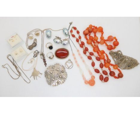 A string of carnelian beads, two vintage glass bead necklaces, silver chains and other items of silver and costume jewellery 