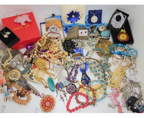 A collection of costume jewellery to include, a Butler &amp; Wilson pig brooch, an owl bangle and other items Condition Repor