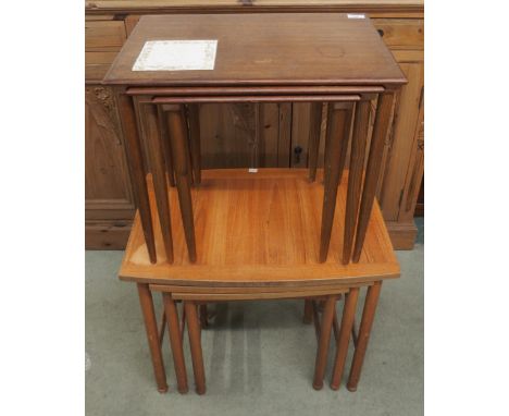 A mid 20th century teak Schreiber nests of three tables and another mid 20th century teak nest of three tables with tile inse