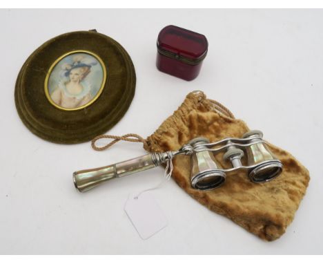 An oval portrait miniature, a pair of opera glasses and a ruby glass trinket box Condition Report:Available upon request