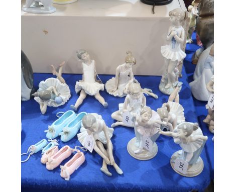 A collection of Nao ballerina figures and ceramic ballet shoes Condition Report:Available upon request