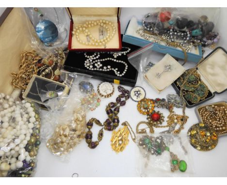 A large collection of vintage costume jewellery to include Bohemian beads, a retro pendant and other items Condition Report:N