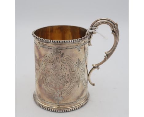 A Victorian silver christening mug, with a double scroll handle and beaded rims, the body with engraved scrolling foliate vig
