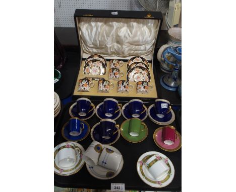 A collection of coffee cans and saucers including Royal Crown Derby, Royal Worcester, Limoges, Shelley, Cauldon and Aynsley C
