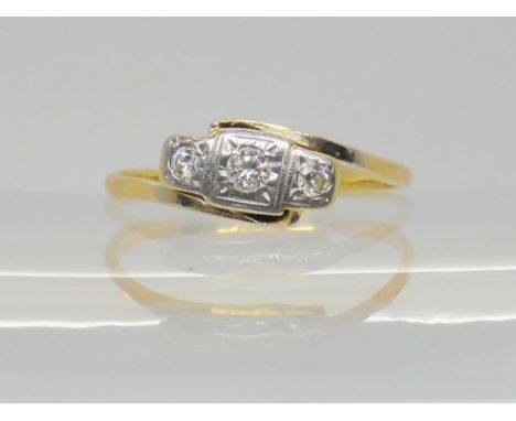 An 18ct gold vintage three stone diamond ring, set with estimated approx 0.10cts of brilliant cut diamonds, size L1/2, weight