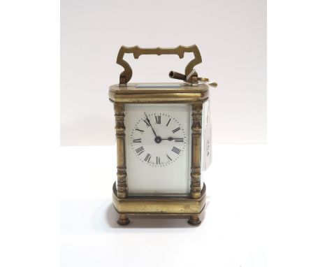 A French brass and glass carriage clock, retailed by Sorley Glasgow, with key Condition Report:winds and ticks