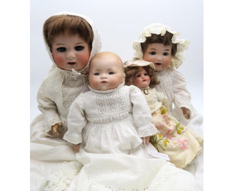 Four assorted bisque-head dolls: three by Armand Marseille, the largest by Heubach Koppelsdorf Condition Report:Available upo