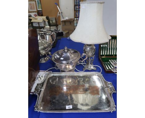 An EPNS lamp, of oval form supported on scrolling legs, with engraved floral decoration, an EPNS tureen, with two scrolling h