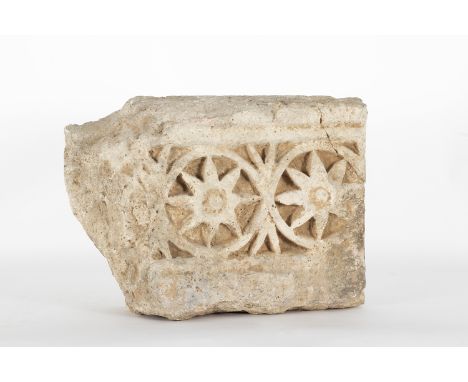 Romanesque architectural fragment in limestone sculpted with geometric motifs, 13th century. 65 x 52 x 17 cm.