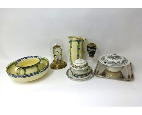 A German 300 day anniversary clock, Royal Doulton three piece jug and basin set of Art Deco design, silver plated serving tra